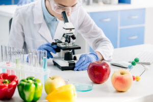 cropped view of molecular nutritionist using microscope and sitt