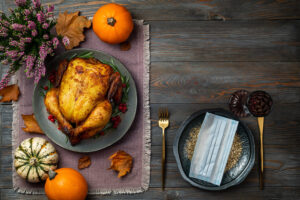 Roasted chicken or turkey for Thanksgiving Day on festive table