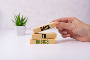 The words back to basics made of letters on wooden blocks. back to basics – fundamental principles concept