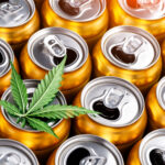 Golden beer cans.The sale of products and drinks with addition of hemp (cannabis) Beer cans with weed on one of them
