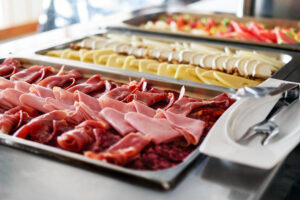 Buffet trays with a various delicious appetizers close-up. Break