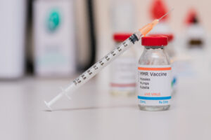 measles mumps and rubella vaccination concept with syringe in va