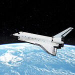 Space shuttle orbiting in  a space over the earth planet and starry background. Elements of this image furnished by NASA.
